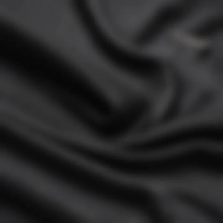 Close-up of fabric texture of a black slim fit t-shirt