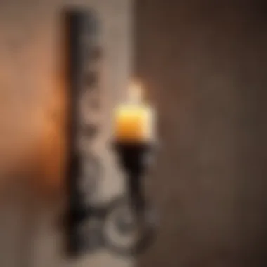 Elegant wrought iron candle holder mounted on a rustic wall.