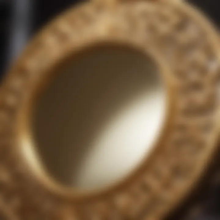 Close-up of intricate design details on a gold lighted mirror