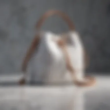 Elegant round bucket bag on a marble surface