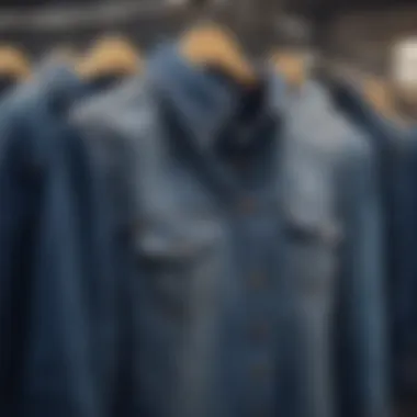A stylish denim shirt dress displayed on a hanger