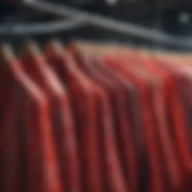 Elegant display of various red printed blouses on hangers showcasing different patterns