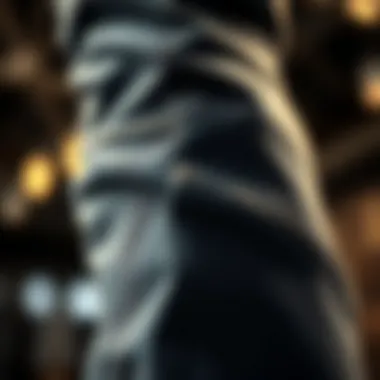 Close-up view of the fabric texture and flare detail of stacked flare jeans