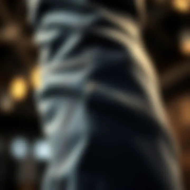 Close-up view of the fabric texture and flare detail of stacked flare jeans