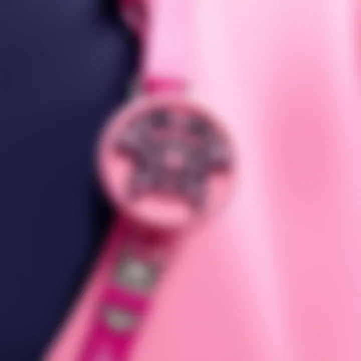 Close-up of a customized pink badge reel showcasing intricate designs