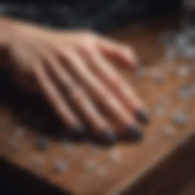 An artistic arrangement of witch nail stickers on a wooden table surrounded by crystals.